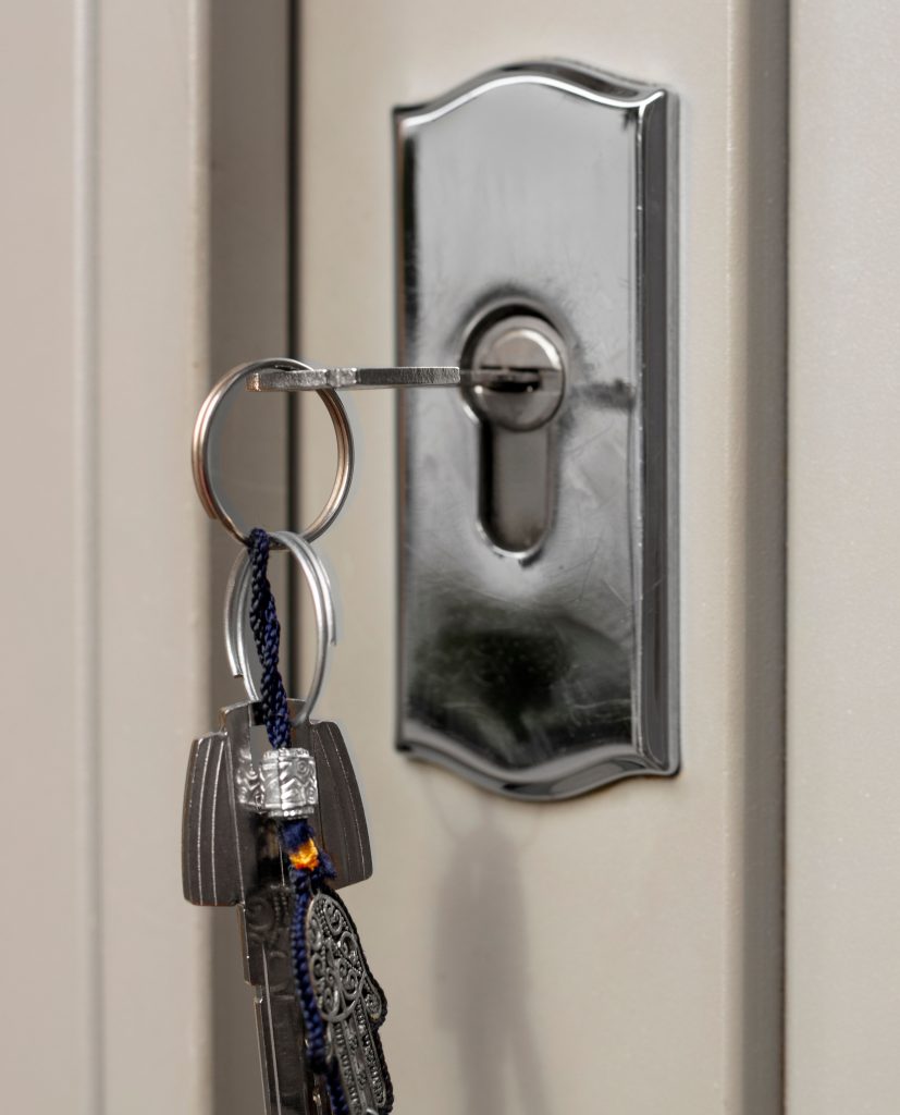 Locksmith opening a front door lock during an emergency in Severn — alt text: “Residential emergency locksmith Severn MD